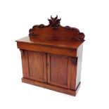 A Victorian flame mahogany chiffonier, with a foliate carved back, straight fronted cushion