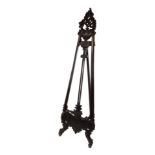 A Rococo style carved hardwood easel, raised on cabriole legs, 216cm high, 62cm wide.