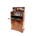 An Art Deco walnut and burr walnut cocktail cabinet, the levered top section opening to reveal a