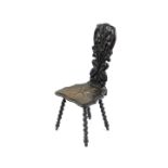 A Victorian oak hall chair, the back carved with serpents, birds and flowers, shaped solid seat,
