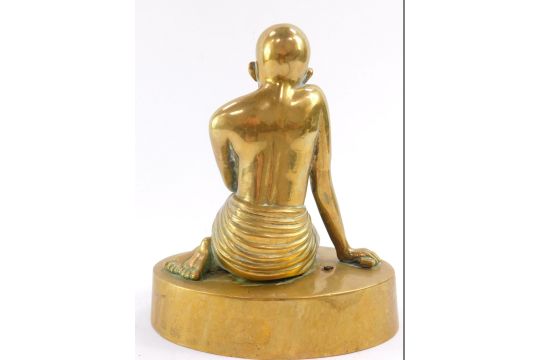 A brass figure of Mahatma Gandhi, modelled kneeling on an oval base, 20cm high. - Image 3 of 4