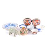 Four Qing dynasty porcelain tea bowls, blue and white bowl, Celadon figure of buffalo and a