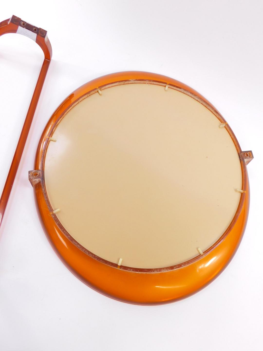 A vintage 1970's orange fibreglass oval wall mirror, 43.5cm high, 50cm wide., together with an - Bild 2 aus 2