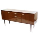 A Schreiber vintage hi gloss teak sideboard, with three central drawers, flanked by two cupboard