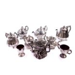 Seven Victorian silver lustre terracotta teapots, one formed as a double sided Toby, together with a