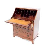 An Adam's style mahogany bureau, the full flap opening to reveal seven recesses and two drawers,