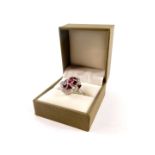 A ruby red enamel and paste set ring, of oblong form, boxed, size P.