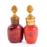 Two 19thC agate ware snuff bottles, with brass lids, having pineapple finials, 10.5cm high.