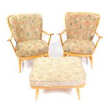 An Ercol light oak and beech three piece Windsor suite, comprising a pair of comb back armchairs,