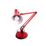 A red anglepoise table lamp, 72cm high extended.