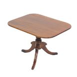 A late Georgian mahogany tilt top occasional table, the curved rectangular top raised on a turned