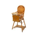 A Belgian early 20thC Beko Deinze blonde oak child's metamorphic high chair.