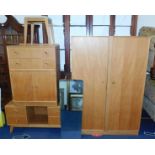 A Meredew mid 20thC light oak bedroom suite, comprising double wardrobe, 176cm high, 123cm wide,