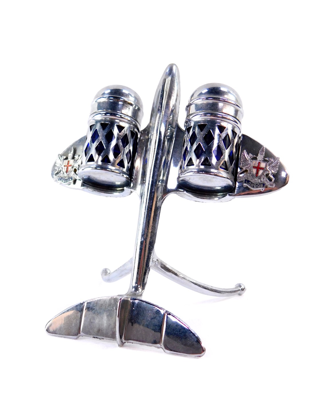 A 1950's chrome aeroplane cruet set, wings mounted with the Arms the City of London, 12cm high.