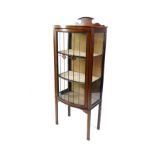 An Edwardian mahogany and line inlaid bow front display cabinet, with glazed sides and door