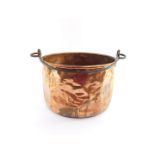 A copper cauldron, with an iron swing handle, 26cm high, 40cm diameter.