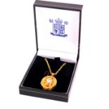 A 9ct yellow and white gold forget-me-not locket, locket contains a single brilliant cut diamond,