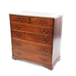 A George III oak chest, of two short over four long graduated drawers, raised on bracket feet, 105cm
