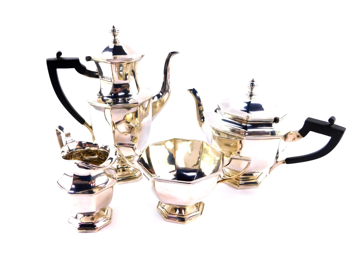 A George V silver four piece tea and coffee set, of octagonal baluster form, comprising teapot,