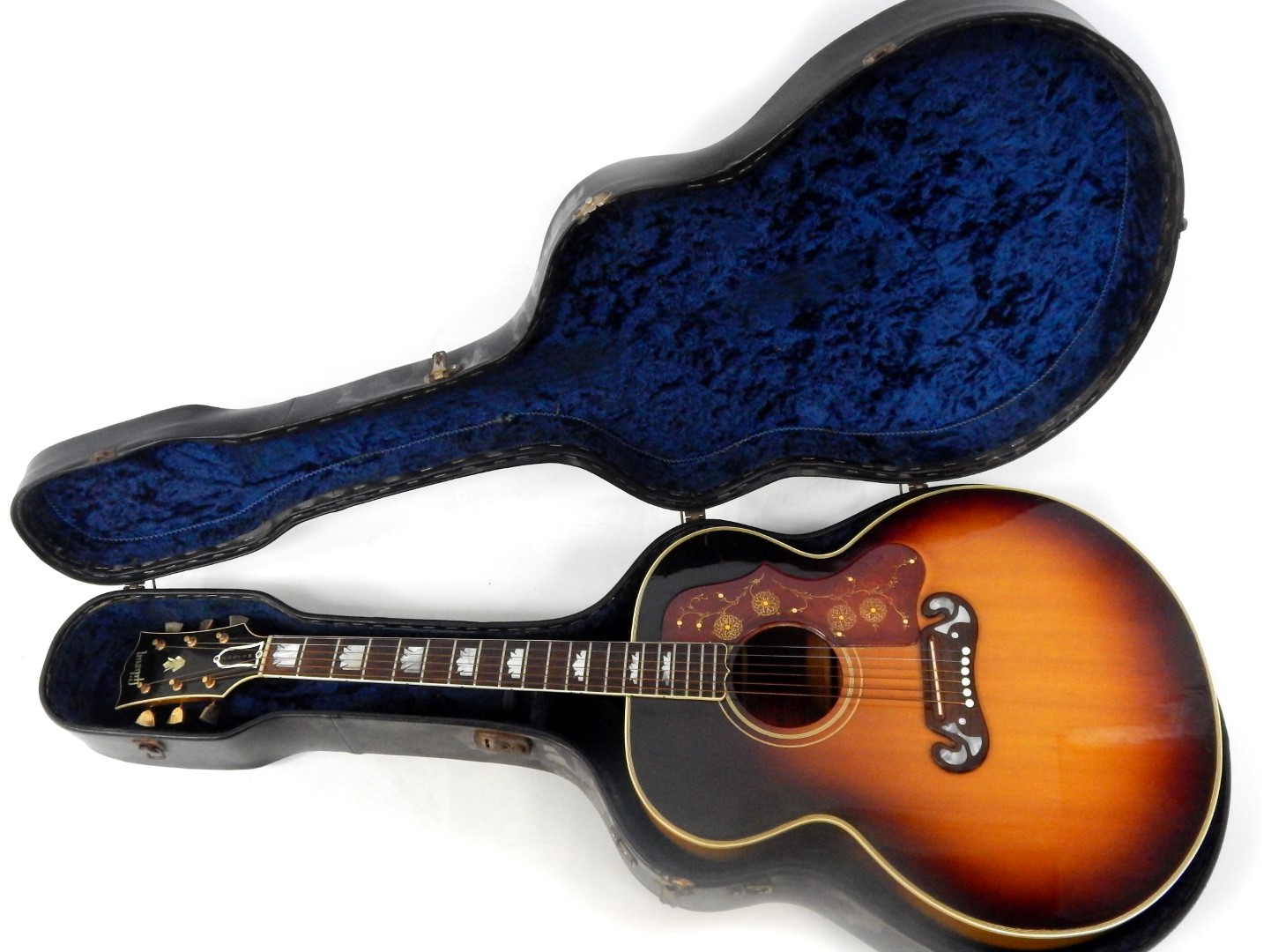 A Gibson J-200 Custom standard acoustic guitar, circa 1963/64, with a maple back and sides, mother-