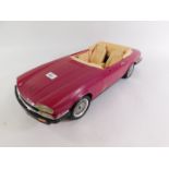 A Barbie Jaguar XJS convertible.