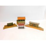 A Hornby Meccano tin plate signal box, shelter, waiting platform and a station (4).