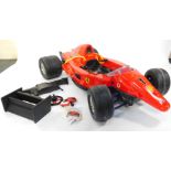 A Toys Toys ride-on electric model of a Ferrari F1 Grand Prix, Produced Under License by Fisher