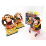 Two Japanese battery operated tin plate dancing Merry Chimps, together with a Daischin battery