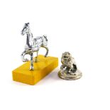 A vintage chrome car mascot, modelled as a prancing horse, raised on a rectangular base, 10cm