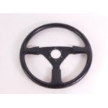 A Momo Racing steering wheel, leather bound, No 10-90, 36.5cm diameter.