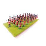 A set of Britains Scots Guards Bandsmen, board mounted. (36)