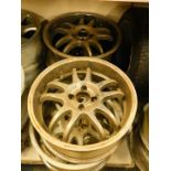 Four Woolf Race 7JX17H2 alloy wheels.