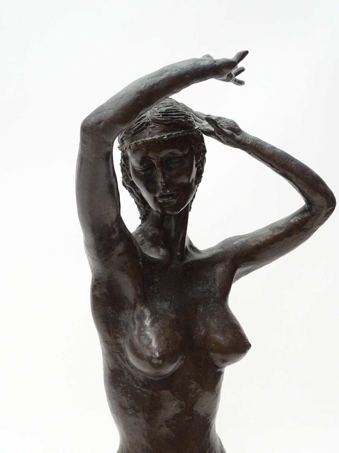 Tom Merrifield (b.1932). A figure of a nude female dancer, on a square plinth decorated with - Image 2 of 3