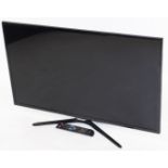 A Samsung 38" flat screen television, in black trim with remote control and wire, UE39F5500AK.