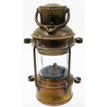 A paraffin miner's type lamp, with applied anchor scroll badge, 26cm high.N.B. This lot is sold on