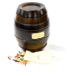 A Remy Martin cognac brandy barrel game, with removable sections and pieces, 28cm high.