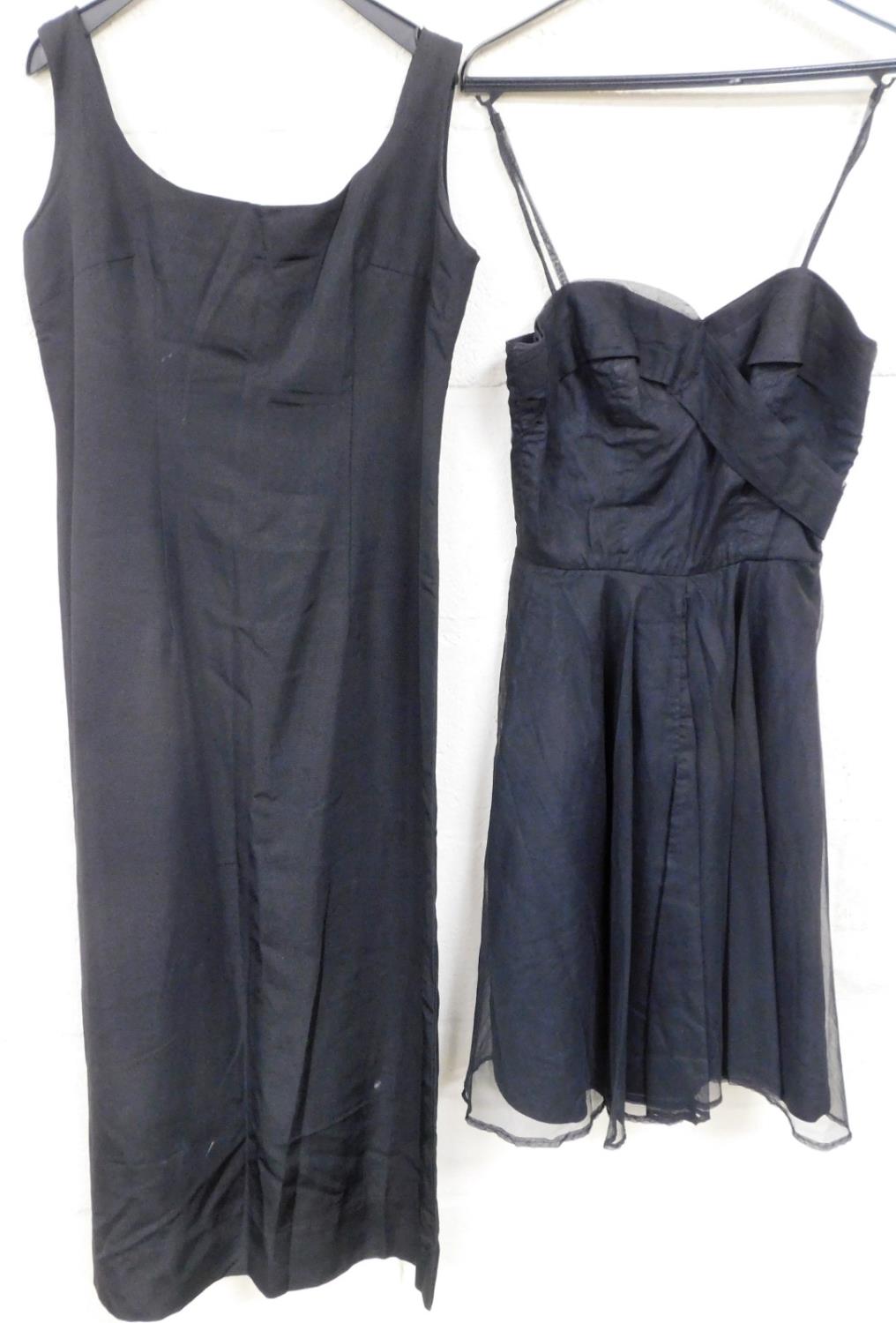 A vintage ladies evening dress in black, and another.