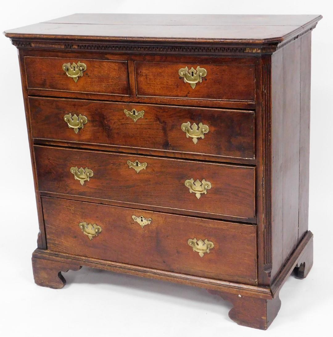 A George III mahogany chest, of two short and three long drawers, each with brass handles, with fret