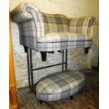 A tartan design two piece lounge suite, comprising two seater settee and oval footstool, 27cm