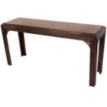 A mahogany finish Chinese design side table, of rectangular form, with a stepped top on fluted