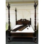 A 20thC hardwood four poster bed, composed with four turned posts set with acanthus leaf and