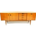 A G-Plan 1950's/1960's teak sideboard, with single cupboard, four drawers and double cupboard, on