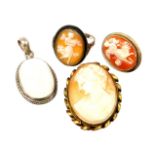 Four items of dress jewellery, comprising an imitation moonstone and silver pendant, a gilt framed