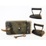 A 19thC cast iron lock, of rectangular form, with key, 12cm wide, and two flat irons, to include