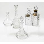 Five decanters, comprising two square cut glass decanters, one with silver rim, each with a silver