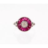 A ruby and diamond target ring, set with central old cut diamond 4.2mm x 4.2mm x 3mm, approx 0.