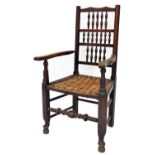 A late 19thC rush seated oak framed side chair, with three section bobbin turned back, on splayed