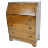 A 1960s oak bureau, with fall enclosing shelf and drawer design, with three drawers with Art Deco