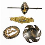 Four brooches, to include a Siamese silver brooch, a marcasite and gold coloured deer brooch,