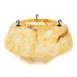 A 1940's light shade, of opaque white fluted design with orange marbled decoration, 30cm wide.